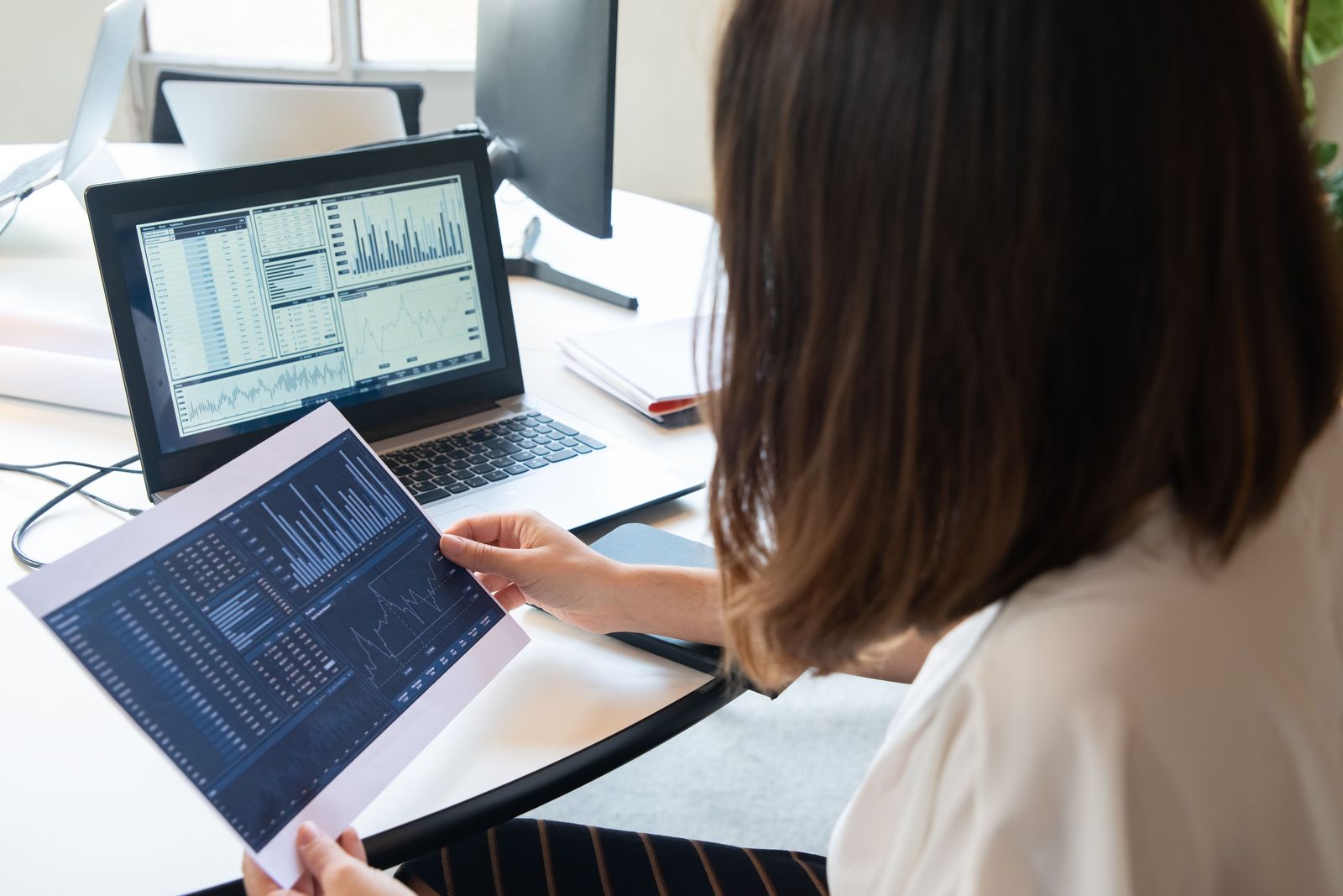 Person reviewing affiliate marketing analytics dashboard on a laptop