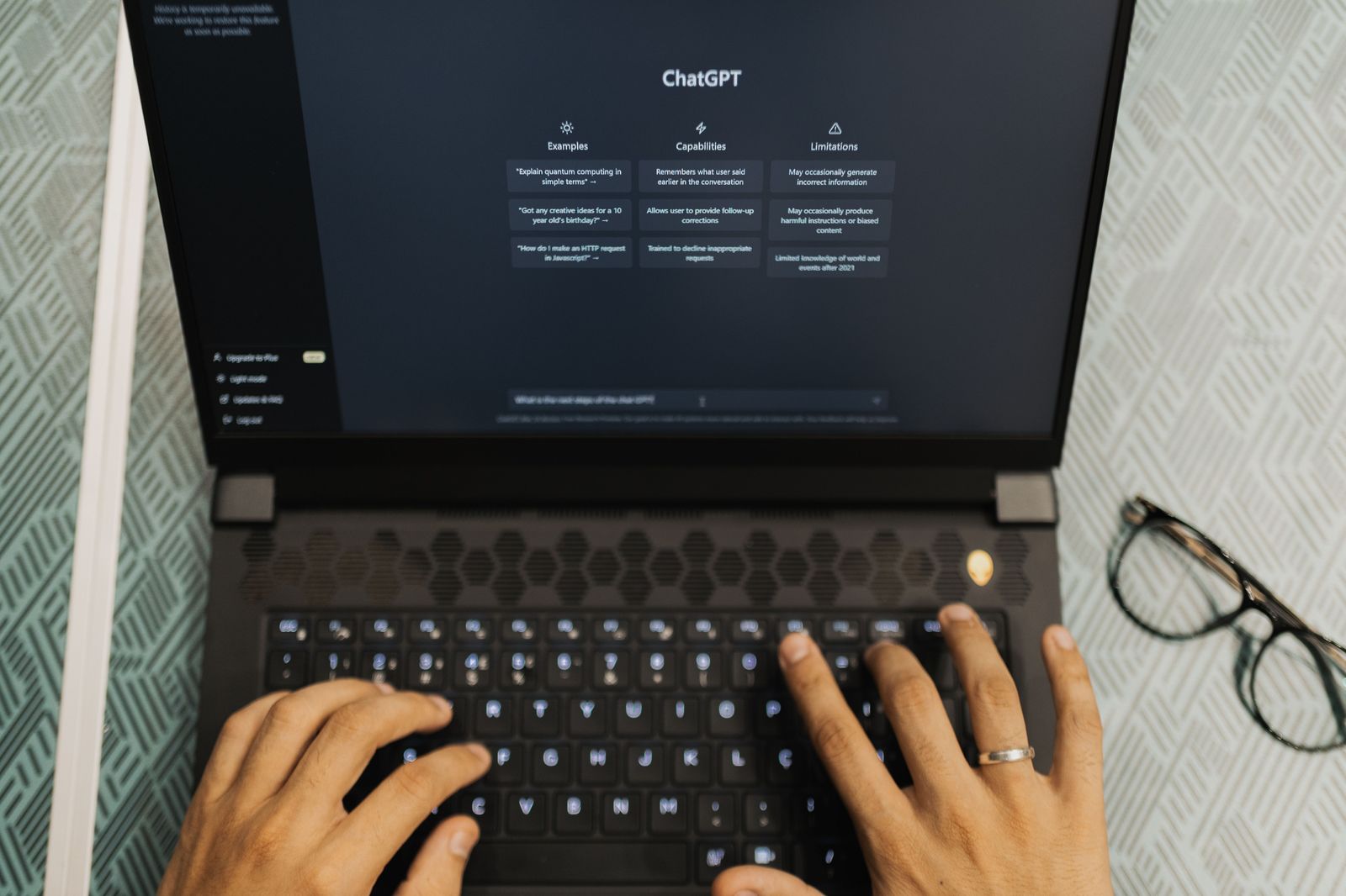 Writer using AI tools to draft content on a laptop