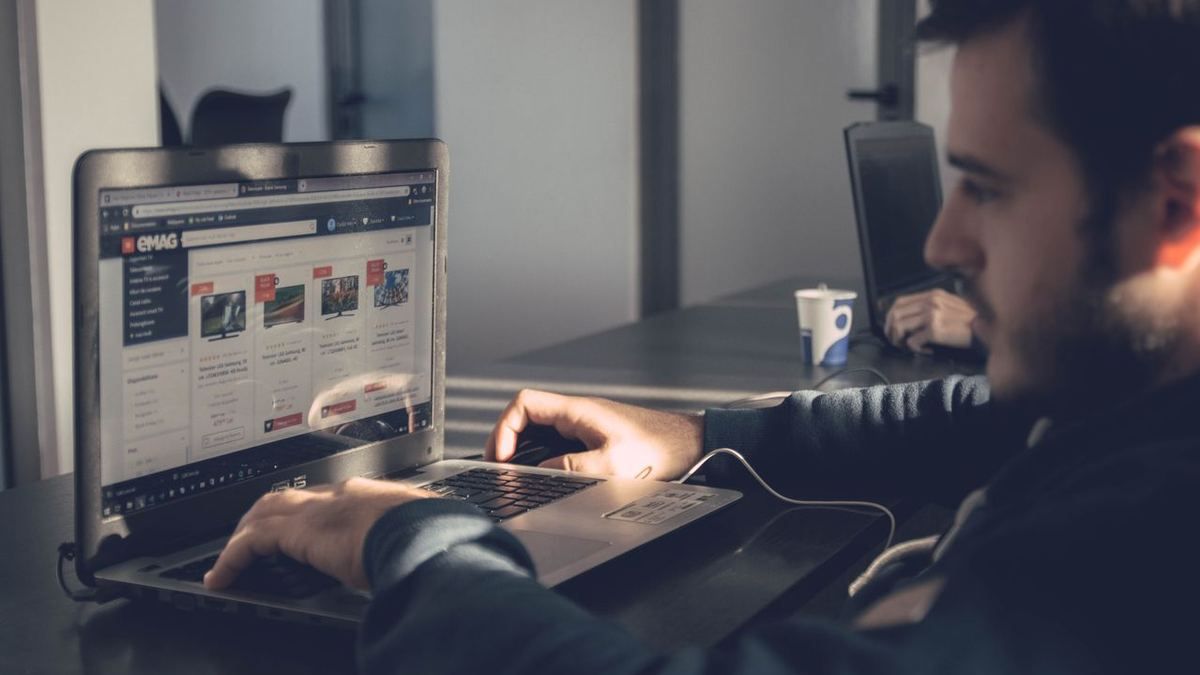 Person browsing an online store on a laptop