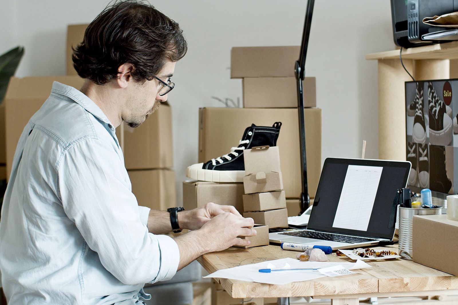 Small business owner packing online store orders for shipping