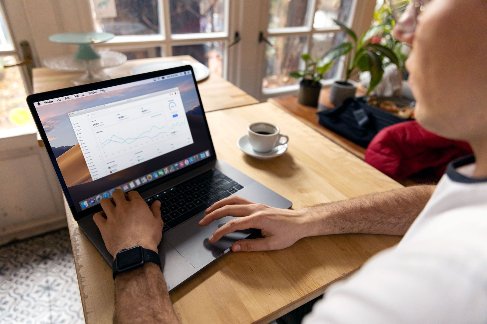 Marketer reviewing email campaign analytics on a laptop